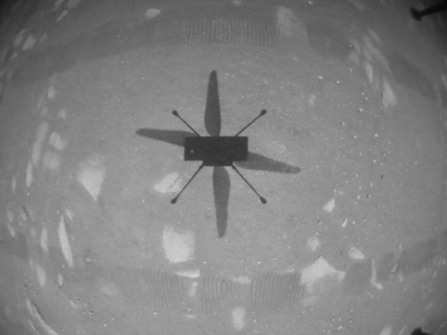 NASA’s Ingenuity Mars Helicopter captured this shot as it hovered over the Martian surface on April 19, 2021, during the first instance of powered, controlled flight on another planet. It used its navigation camera, which autonomously tracks the ground during flight. (Photo: NASA/JPL-Caltech)