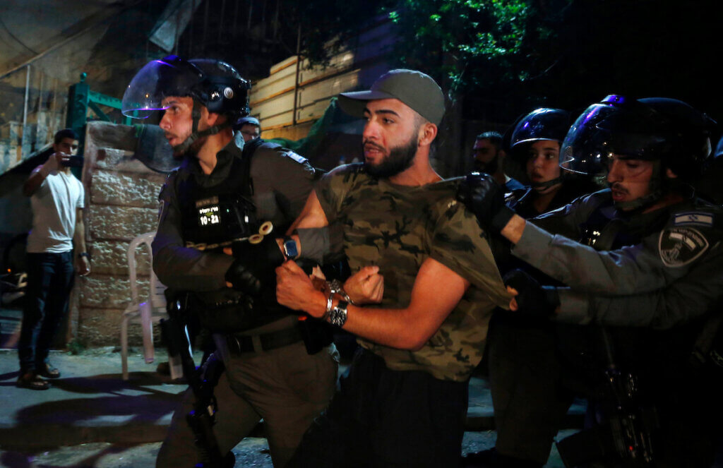 Israeli forces detain a Palestinian protester in the Sheikh Jarrah neighborhood of Jerusalem, on May 05, 2021. (Photo: Jamal Awad/APA Images)