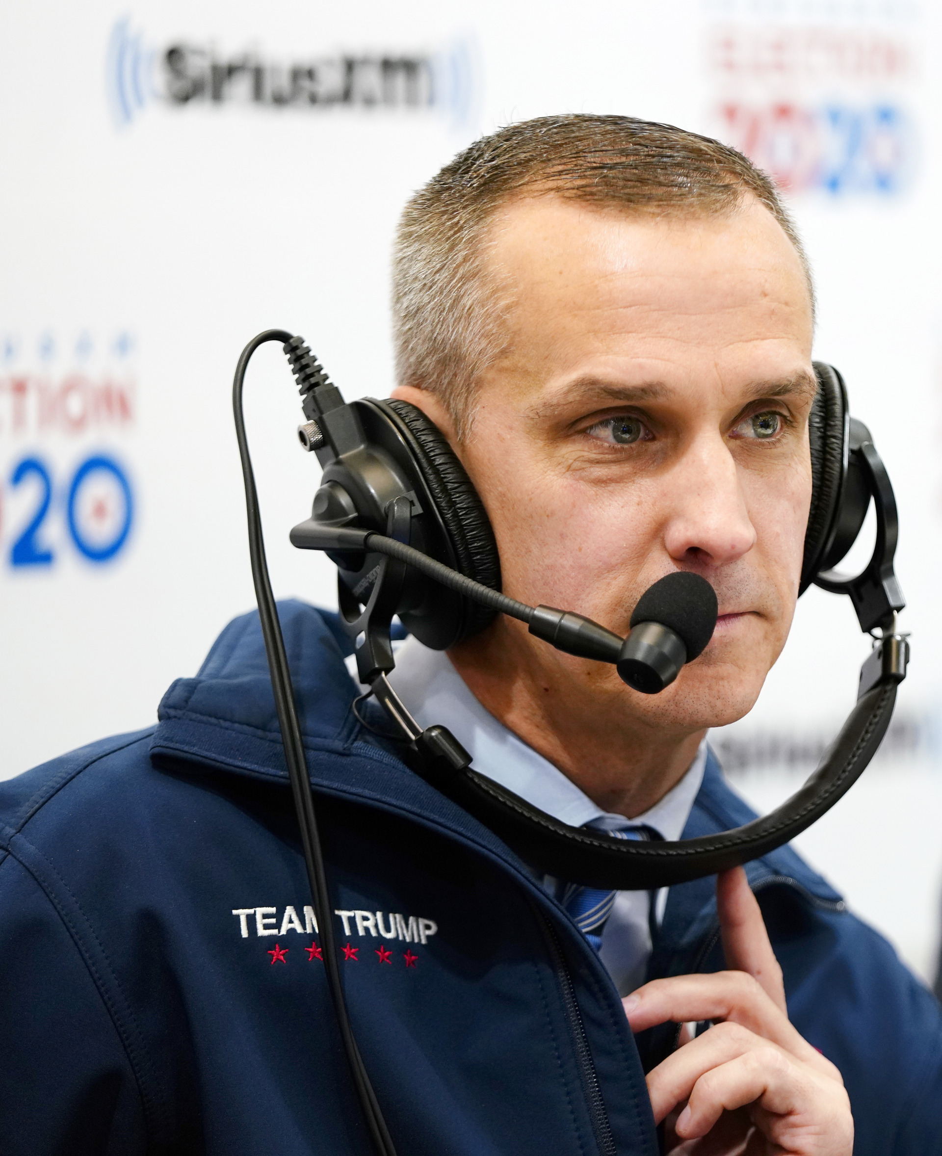 Senior adviser to Trump 2020, Corey Lewandowski looks on while talking with Sirius XM P.O.T.U.S host Tim Farley and David Bossie in the Coolidge Room at the DoubleTree by Hilton on February 11, 2020 in Manchester, New Hampshire. (Photo by Omar Rawlings/Getty Images for SiriusXM)