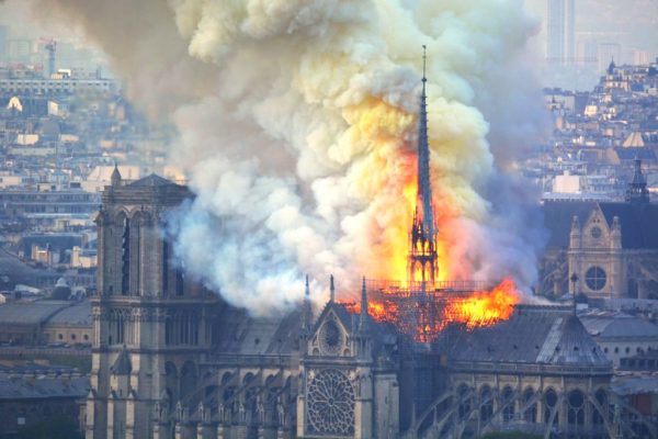 Smoke and flames rise during a fire at the landmark Notre-Dame Cathedra