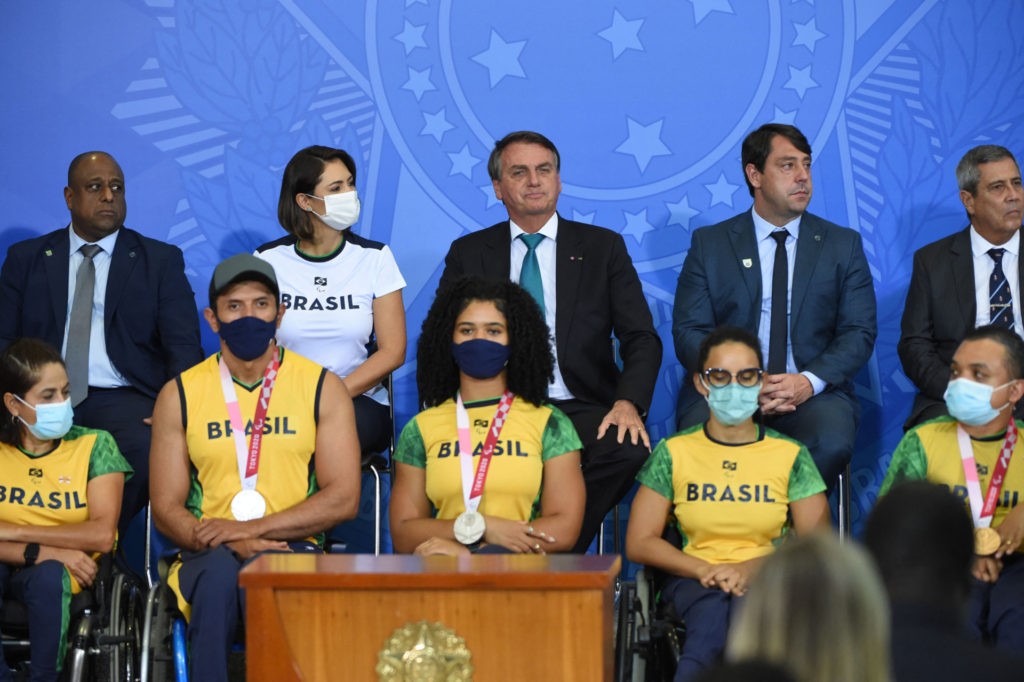 Brazilian President Jair Bolsonaro (C back row) attends a ceremony for the Olympic and Paralympic athletes who participated in the Tokio 2020 Olympic Games, at Planalto Palace in Brasilia, on October 6, 2021. (Photo by EVARISTO SA / AFP) (Photo by EVARISTO SA/AFP via Getty Images)
