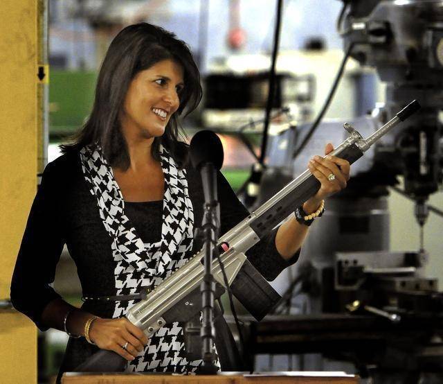 Gov. Nikki Haley looks over a personalized PTR semi-automatic rife she was presented during a tour of the Aynor plant last year.