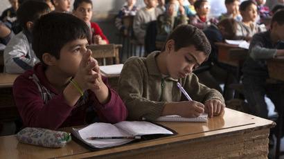 Students attend a class at a school in Aleppo's Bustan al-Qasr (Reuters/Mahmoud Hassano)