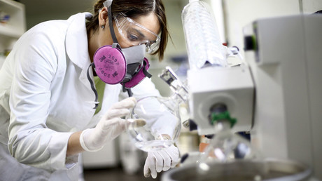 A worker uses a laboratory instrument to obtain lactone, which is used by biochemists to develop a possible Zika-repellent clothes detergent additive, at 