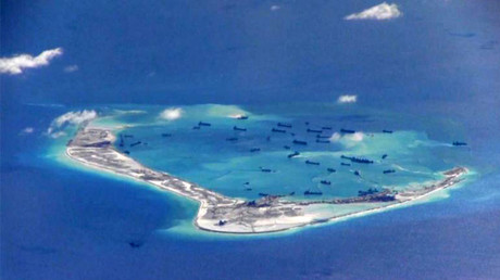Chinese dredging vessels purportedly seen in the waters around Mischief Reef in the disputed Spratly Islands in the South China Sea. © U.S. Navy / Handout via Reuters