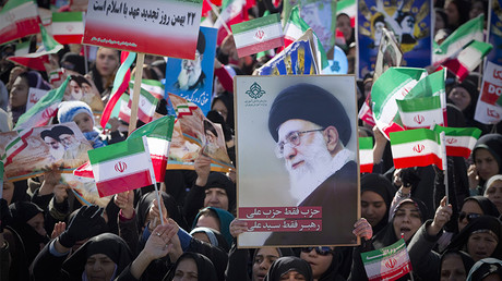 

FILE PHOTO: Demonstrators wave the Iranian flag and hold a picture of Supreme Leader Ayatollah Ali Khamenei © Caren Firouz 