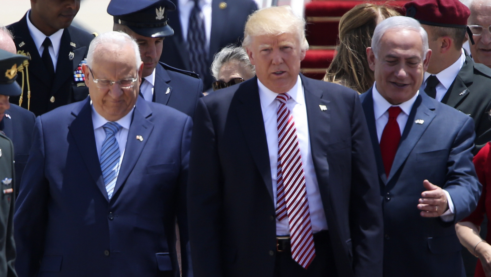 US President Donald Trump walks on his arrival accompanied by the Israeli President Rueben Rivlin, right, and Prime Minister Benjamin Netanyahu in Tel Aviv, Monday, May 22,2017. (AP/Oded Balilty)