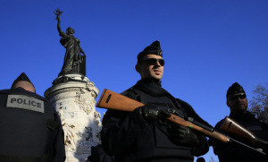 Police stand guard in Place de la Republique, Paris, don't exactly make the state of emergency in Turkey more palatable. Courtesy Rossignol/REUTERS