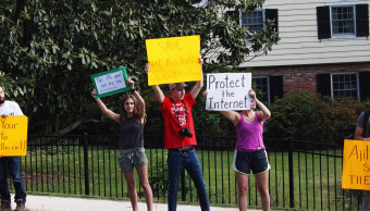 Some of Ajit Pai neighbors came out and joined the protest in his neighborhood. May 14, 2017. Photo by Eleanor Goldfield.