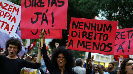 A protest against Brazil's President Michel Temer. The signs read: 