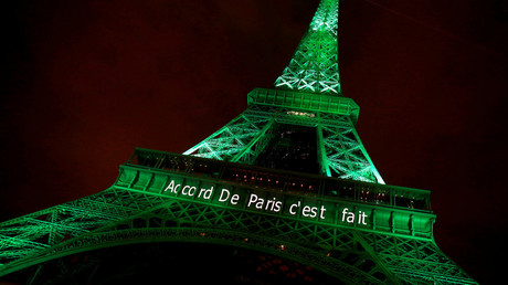FILE PHOTO: The Eiffel tower is illuminated in green with the words 