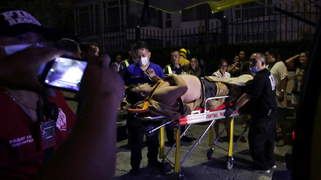 An injured hotel guest is seen outside of a hotel © Reuters
