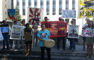   Demonstrators protest the Dakota Access pipeline outside a federal courthouse in Washington, D.C., on Wednesday. (Clara Romeo / Truthdig)