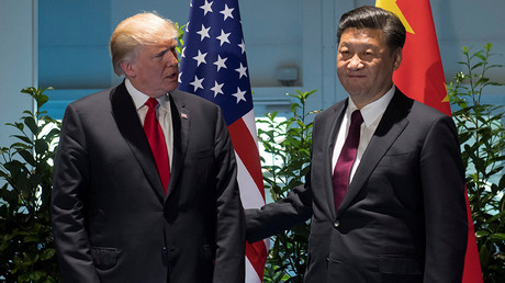 US President Donald Trump and Chinese President Xi Jinping (R) meet on the sidelines of the G20 Summit in Hamburg, Germany, July 8, 2017 © Saul Loeb