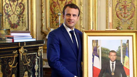 French President Emmanuel Macron poses with his official portrait © Thibault Camus
