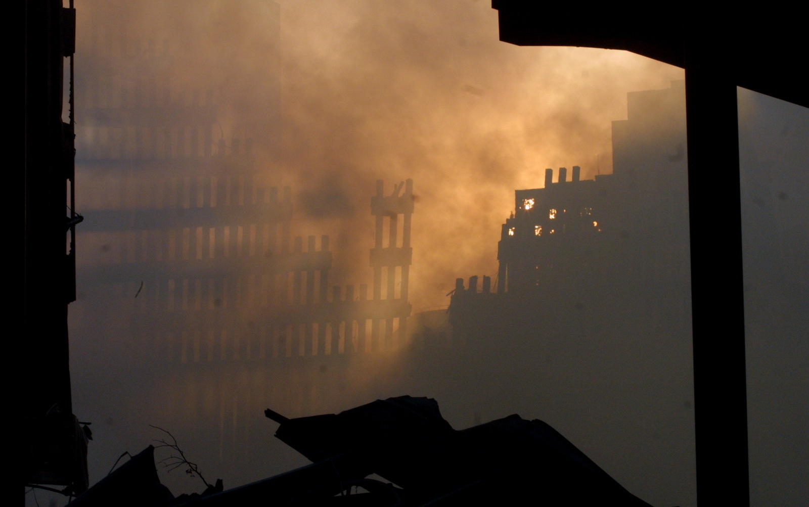 Light is seen through the debris at ground zero on September 12, 2001 after the September 11 terrorist attacks.(AP/Baldwin)