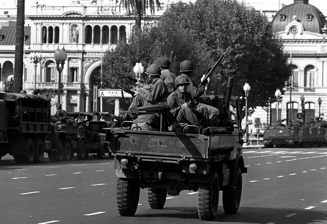 Army soldiers patrol the Buenos Aires Plaza de Mayo on March 24, 1976 after a military coup led by Gen. Jorge Rafael Videla overthrew President Isabel Peron. (AP/Eduardo Di Baia)