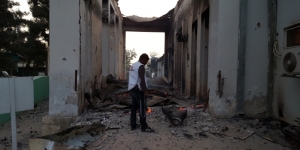 An MSF staff worker walking through the ruins of the Trauma Hospital in Kunduz, hours after the air rain on October 3, 2015.