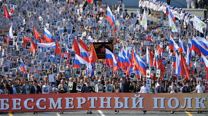 Participants during the march of the Immortal Regiment Moscow regional patriotic public organization on Red Square. (RIA Novosti/Vladimir Pesnya)