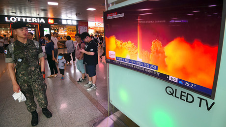 A South Korean soldier watches a video footage of North Korea's launch of an intercontinental ballistic missile, at a railway station in Seoul © Jung Yeon-Je / AFP