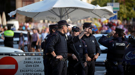 Police officers stand at a road block at the beginning of fiestas in Bilbao, Spain August 19, 2017 © Vincent West