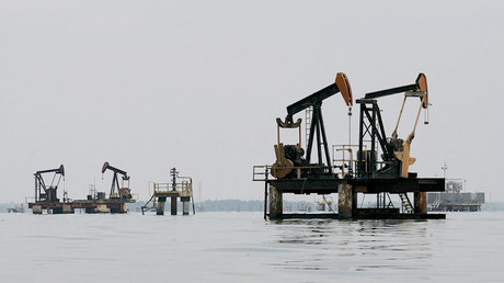 Oil pumps are seen in Lake Maracaibo, in Lagunillas, Ciudad Ojeda, in the state of Zulia, Venezuela. © Isaac Urrutia