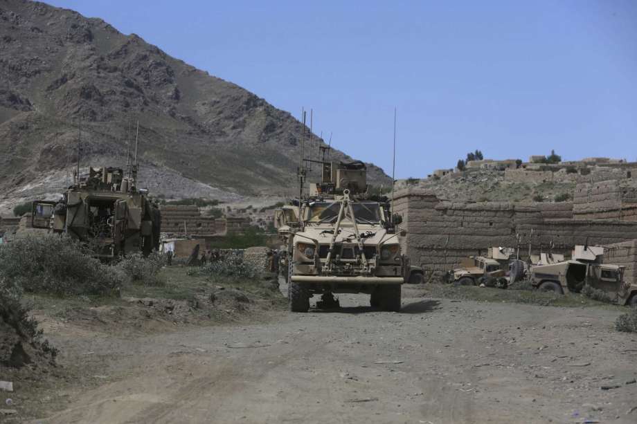 U.S. forces and Afghan commandos are seen in Asad Khil near the site of a U.S. bombing in the Achin district of Jalalabad, east of Kabul, Afghanistan, Saturday, April 17, 2017. U.S. forces in Afghanistan on Thursday struck an Islamic State tunnel complex in eastern Afghanistan with the largest non-nuclear weapon every used in combat by the U.S. military, Pentagon officials said. (AP Photo/Rahmat Gul) Photo: Rahmat Gul, STF / Copyright 2017 The Associated Press. All rights reserved.