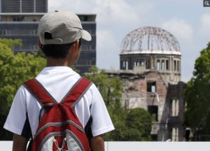 A boy looks at the Hiroshima Peace Memorial Park on the 72nd anniversary of the bomb, August 2017. Kimimasa Mayama / EPA 