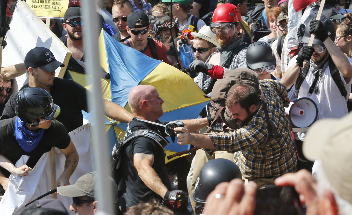 White nationalist demonstrators clash with counter demonstrators at the entrance to Lee Park in Charlottesville, Va., Aug. 12, 2017. (AP/Steve Helber)