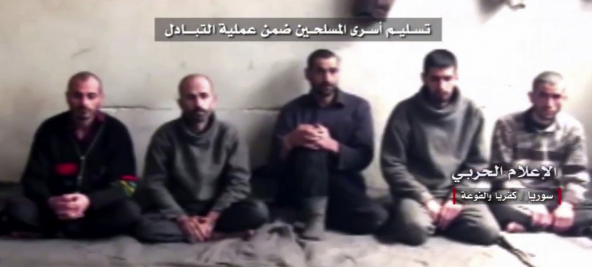 This frame grab from video provided by Syrian Central Military Media, shows Syrian rebels about to be released as part of a government deal to evacuate over 10,000 residents from Madaya and Zabadani, near Damascus, Syria, April 12, 2017. 