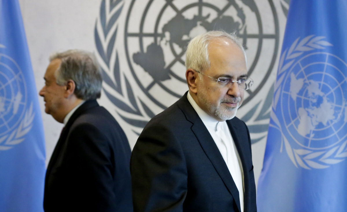 United Nations Secretary-General Antonio Guterres, left, and Iran's Foreign Minister Javad Zarif prepare to take their seats for a meeting, Monday, July 17, 2017, at U.N. headquarters. (AP/Bebeto Matthews)