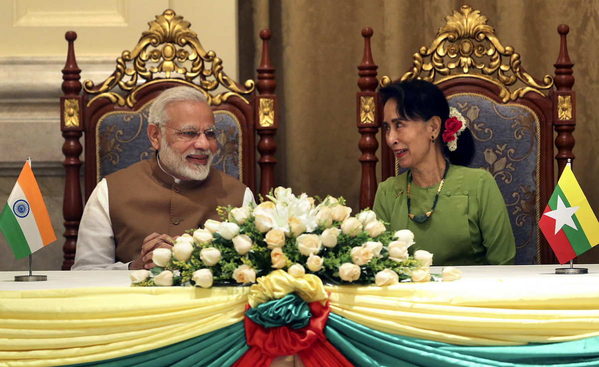 Myanmar's State Counsellor Aung San Suu Kyi, right, speaks with India's Prime Minister Narendra Modi during their Memorandum of Understanding (MOU) at the Presidential Palace in Naypyitaw, Myanmar, Sept. 6, 2017. (AP Photo)
