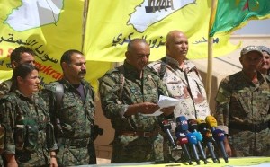 Ahmad Abu Khawlah (3rd-R), chief of the Deir ez-Zor Military Council -- a coalition of Arab tribes and fighters that belongs to the broader US-backed Syrian Democratic Forces -- speaks during a press conference in the northeastern Syrian village of Abu Fas, on the southern outskirts of Hasakah province, on September 9, 2017 (Courtesy YPG)