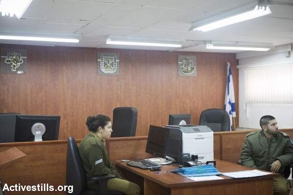 Israel soldiers in a courtroom at the Ofer Military Court near the West Bank town of Beitunia, February 8, 2015. (Oren Ziv/Activestills.org)