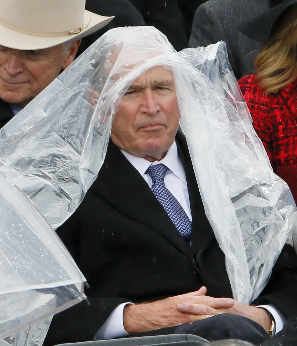 Photos of George W. Bush struggling with his rain poncho during President Trump's inauguration seemed to garner more media coverage than many of the former president's darker days. (Photo: Rueters/Rick Wilking)