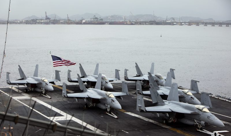 Fighter jets sit on the deck of aircraft carrier USS Carl Vinson, at the Guanabara bay in Rio de Janeiro, Feb. 26, 2010. (AP/Silvia Izquierdo)