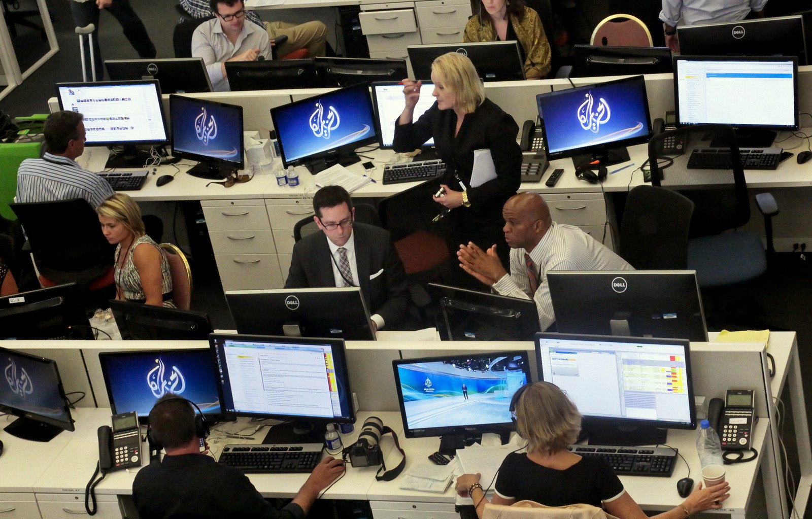 Al-Jazeera America editorial newsroom staff preparing for their first broadcast in New York. (AP/Bebeto Matthews)