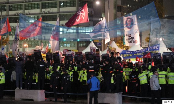 Protesters and police in South Korea at Trump Hotel