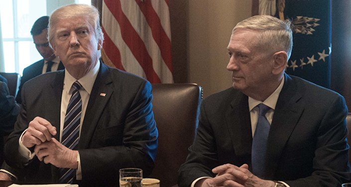 US President Donald Trump prepares to speak to the press before he meets with his cabinet in the Cabinet Room at the White House in Washington, DC, on March 13, 2017, as Defense Secretary James Mattis looks on
