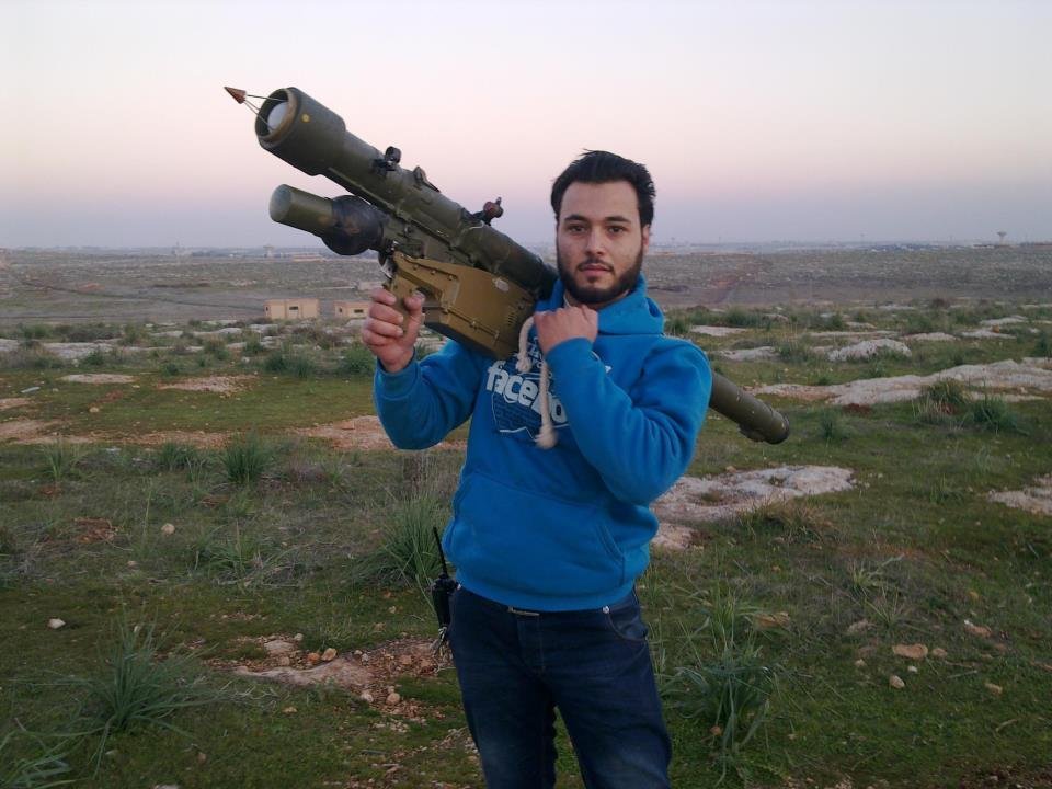 Iessa Obied, a medical professional connected with Hand in Hand for Syria, poses with rocket launcher.
