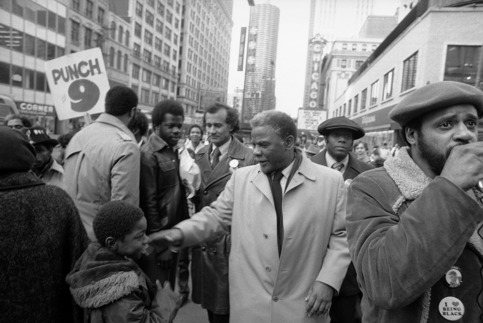 U.S. Rep. Harold Washington greets a younger member of the crowd as he campaigned along State Street in Chicago on, Feb. 22, 1983. (AP/Lee Balgemann)
