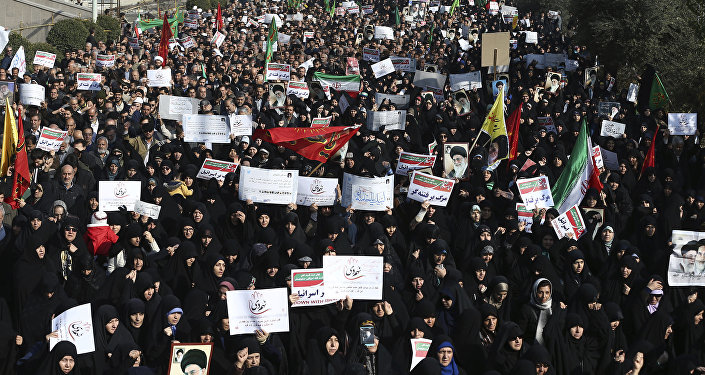 Iranian protesters chant slogans at a rally in Tehran, Iran, Saturday, Dec. 30, 2017