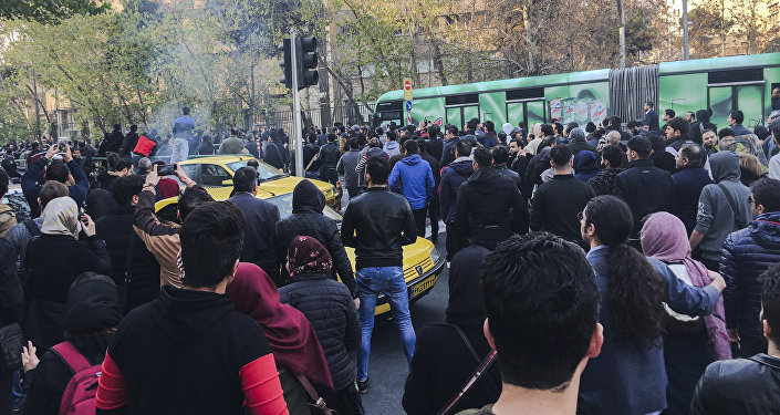 This photo taken by an individual not employed by the Associated Press and obtained by the AP outside Iran, demonstrators attend a protest over Iran's weak economy, in Tehran, Iran, Saturday, Dec. 30, 2017
