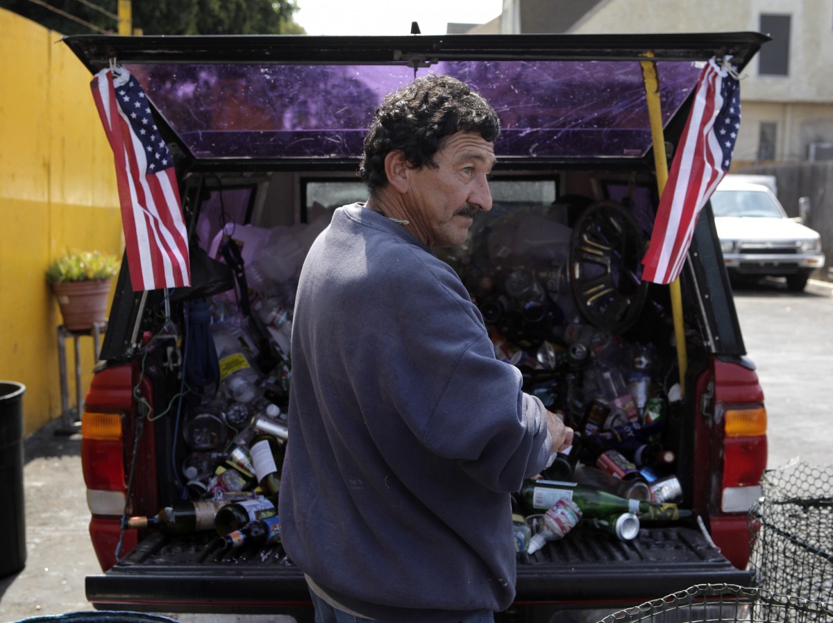 Jose Guillen, 68, sorts recyclable items at a recycling center in Los Angeles, Sept. 14, 2011. The ranks of the nation’s poor have swelled to a new records — nearly 1 in 6 Americans. (AP/Jae C. Hong)