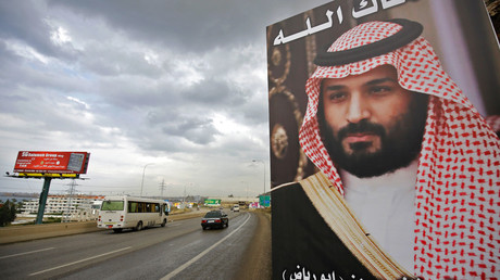 A poster of Saudi Arabia’s Crown Prince Mohammed bin Salman with a phrase reading in Arabic, ” God protect you” is seen on a highway in the northern Lebanese port city of Tripoli on November 9, 2017 © Ibrahim Chalhoub