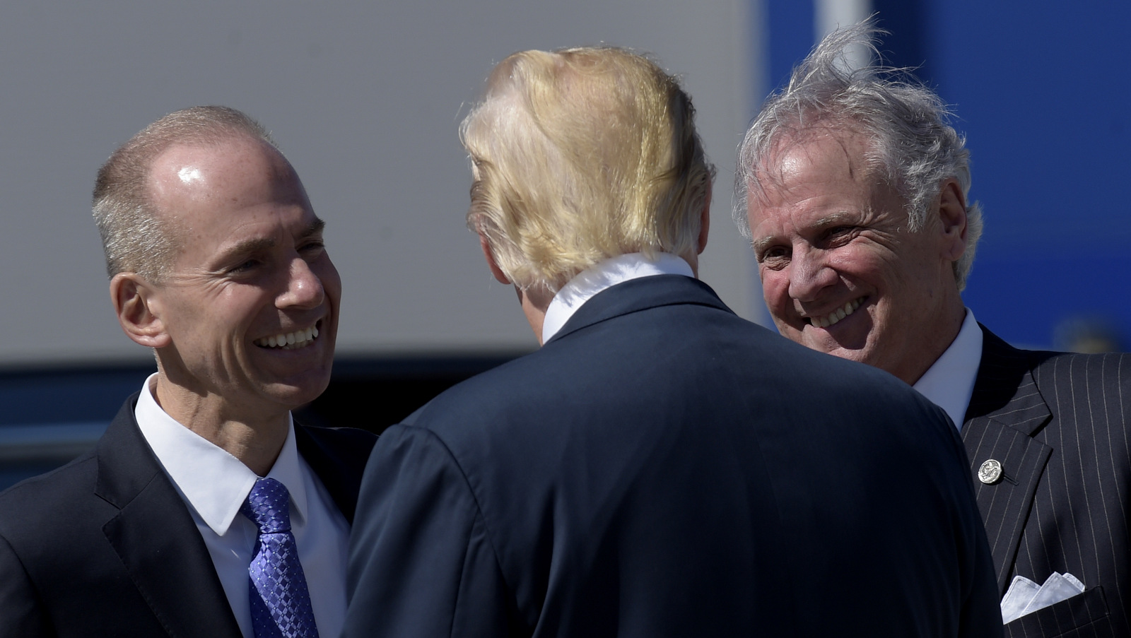 President Donald Trump talks with Boeing CEO Dennis Muilenburg, left, and South Carolina Gov. Henry McMaster after arriving at Charleston International Airport for a visit to the Boeing South Carolina facility before heading to his Mar-a-Lago estate in Palm Beach, Fla., for the weekend. (AP/Susan Walsh)