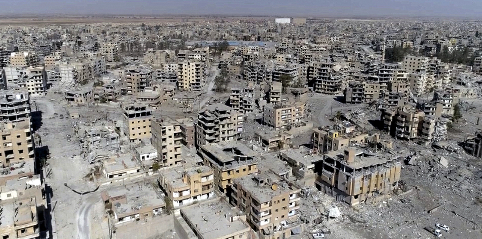 This Thursday, Oct. 19, 2017 frame grab made from drone video shows damaged buildings in Raqqa, Syria, two days after Syrian Democratic Forces said that military operations to oust ISIS have ended and that their fighters have taken full control of the city. (AP/ Gabriel Chaim)
