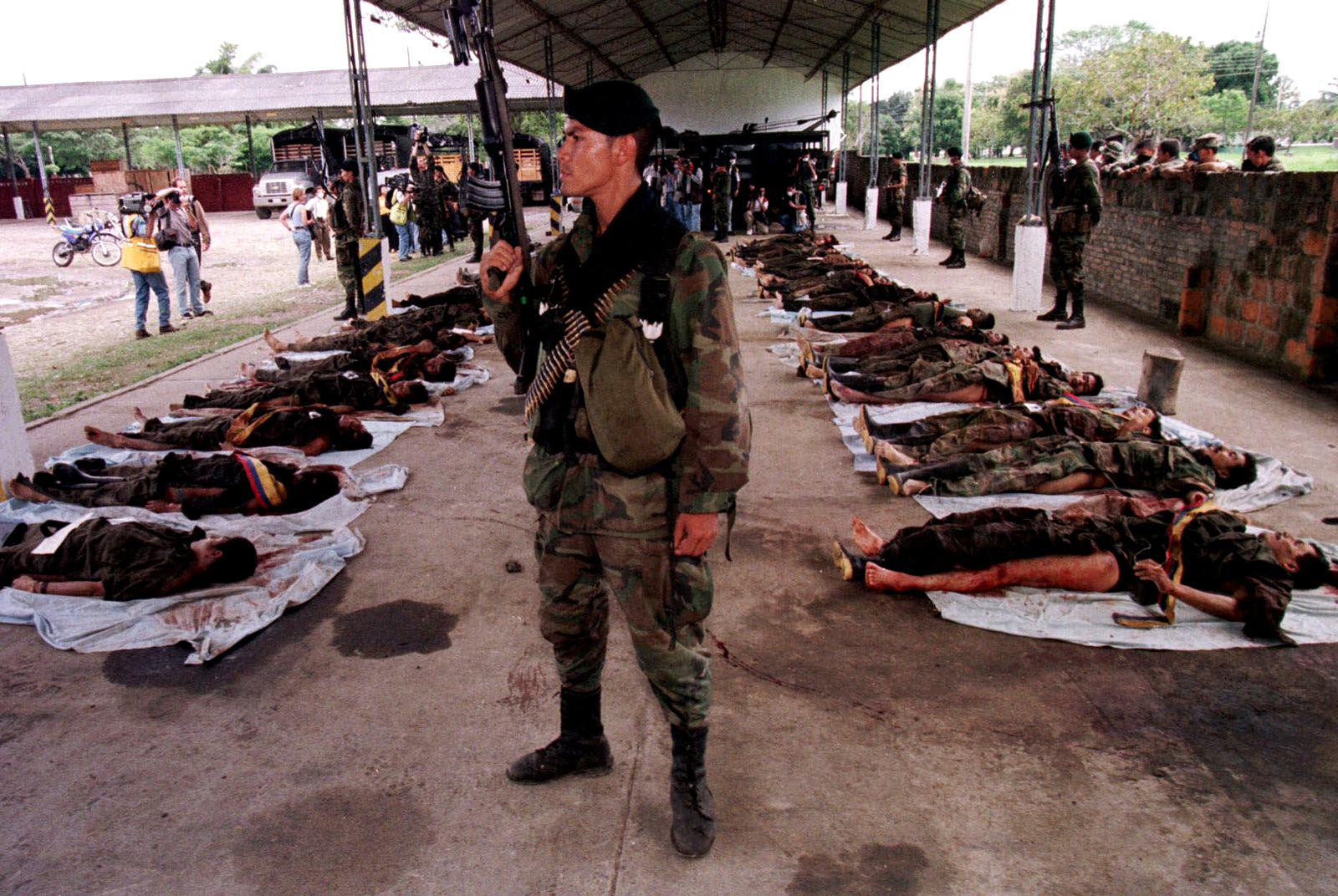 Colombian soldiers display the bodies of 30 Revolutionary Armed Forces of Colombia, or FARC, rebels to the prress in Granada, about 180 kilometers (112 miles) outside of Bogota, Colombia, Monday, July 12, 1999. (AP/Scott Dalton)
