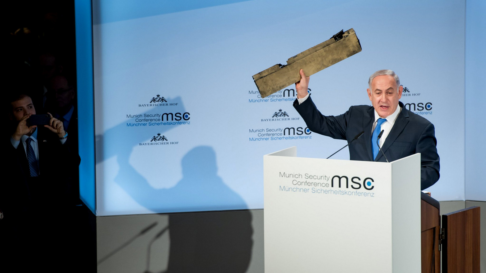 Prime Minister Benjamin Netanyahu of Israel, displays what he alleges is a remnant of an Iranian drone shot down over Israeli airspace at the Munich Security Conference in Germany. (Lennart Preiss/Reuters)