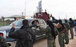 Pro-Syrian-government fighters entering Afrin with YPG fighters greeting them welcome. Photo courtesy AFP
